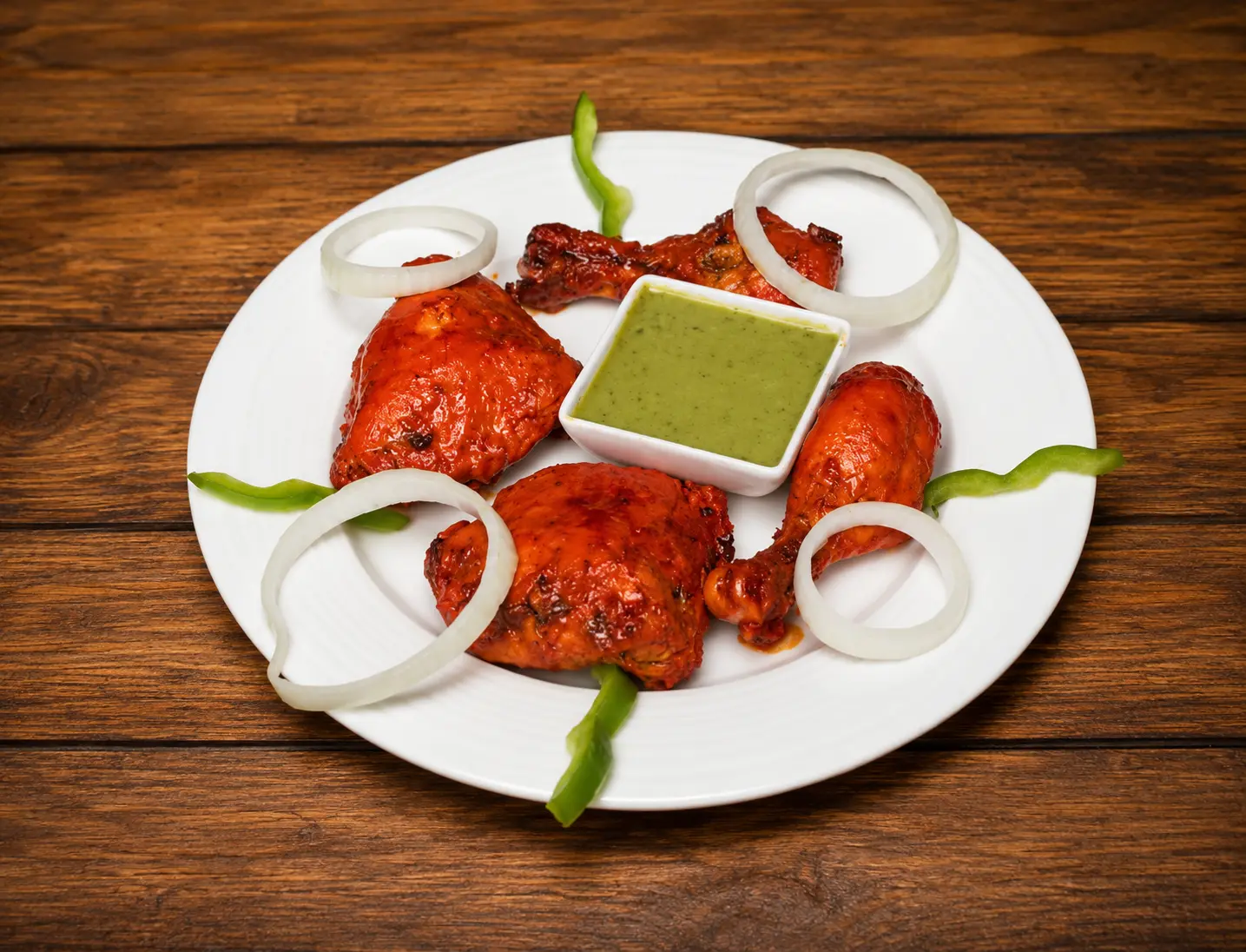 Halal tandoori chicken with onion, lime and mint chutney at Charisma Of India in Winnipeg